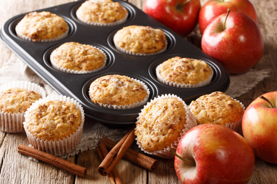 Sweet dessert apple muffins with cinnamon close-up in a baking dish on the table. horizontal
