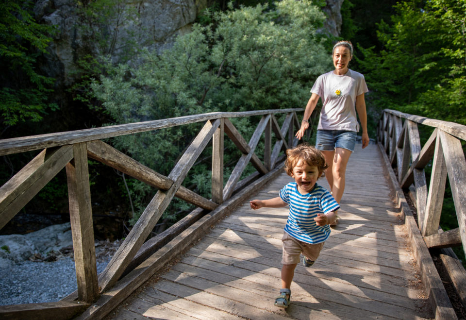 Playful toddler enjoying nature on a summer day