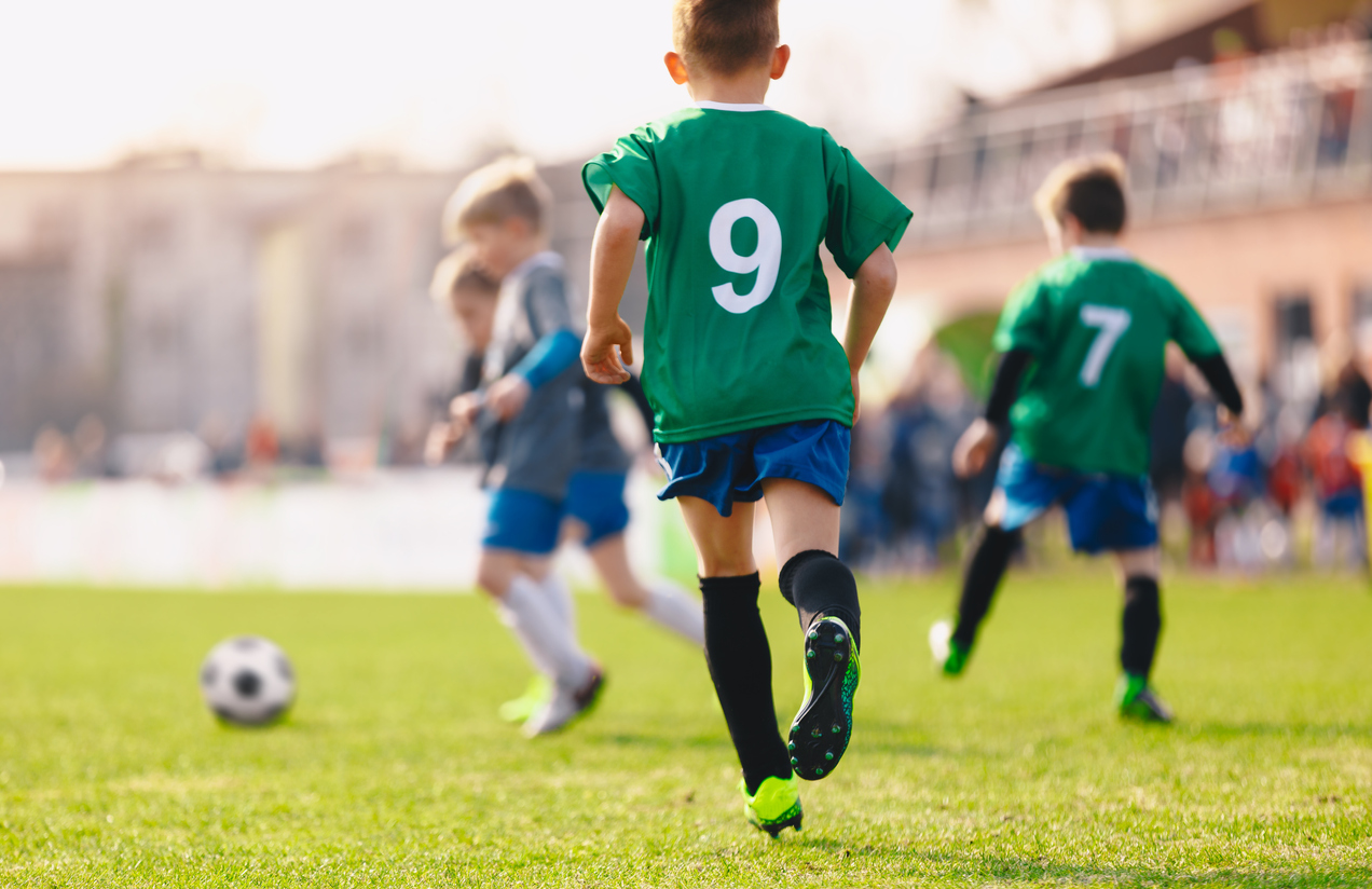 Boys playing in a soccer match