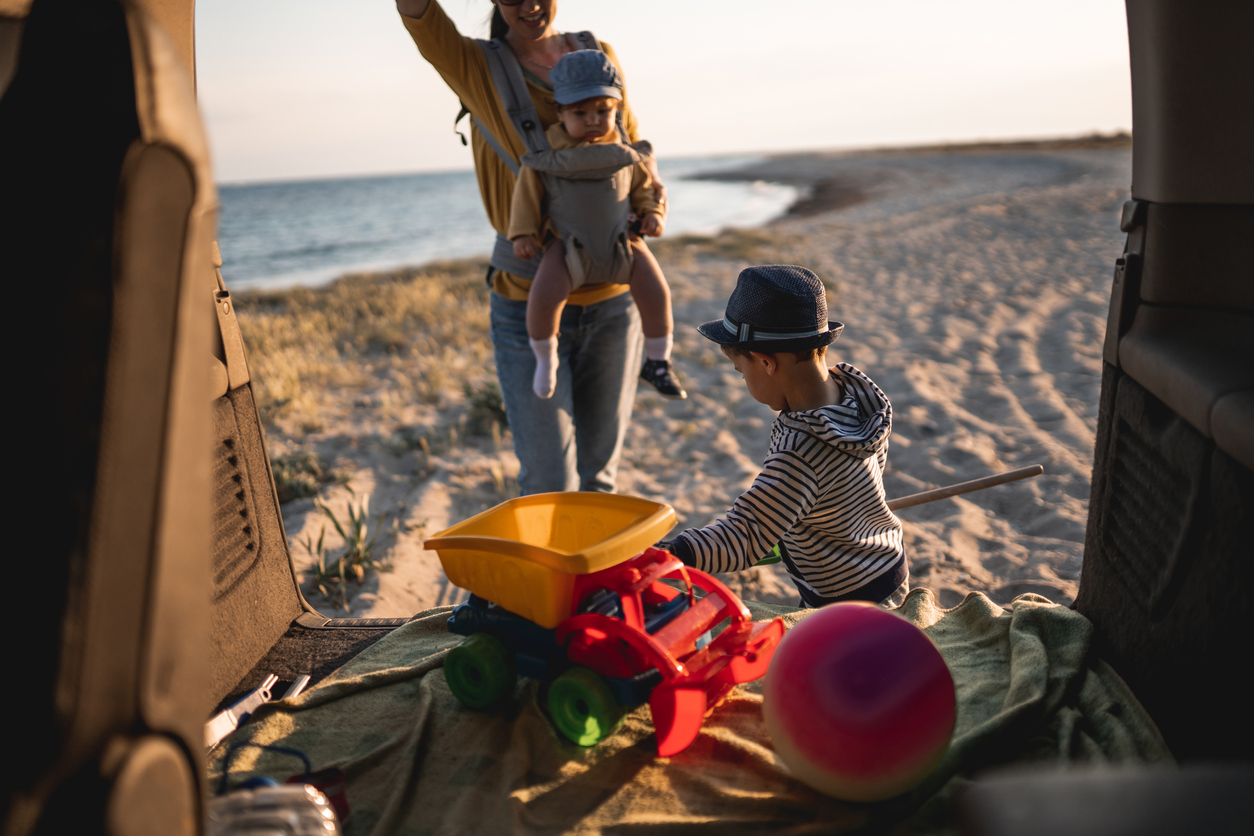 Mother with her kids on the beach